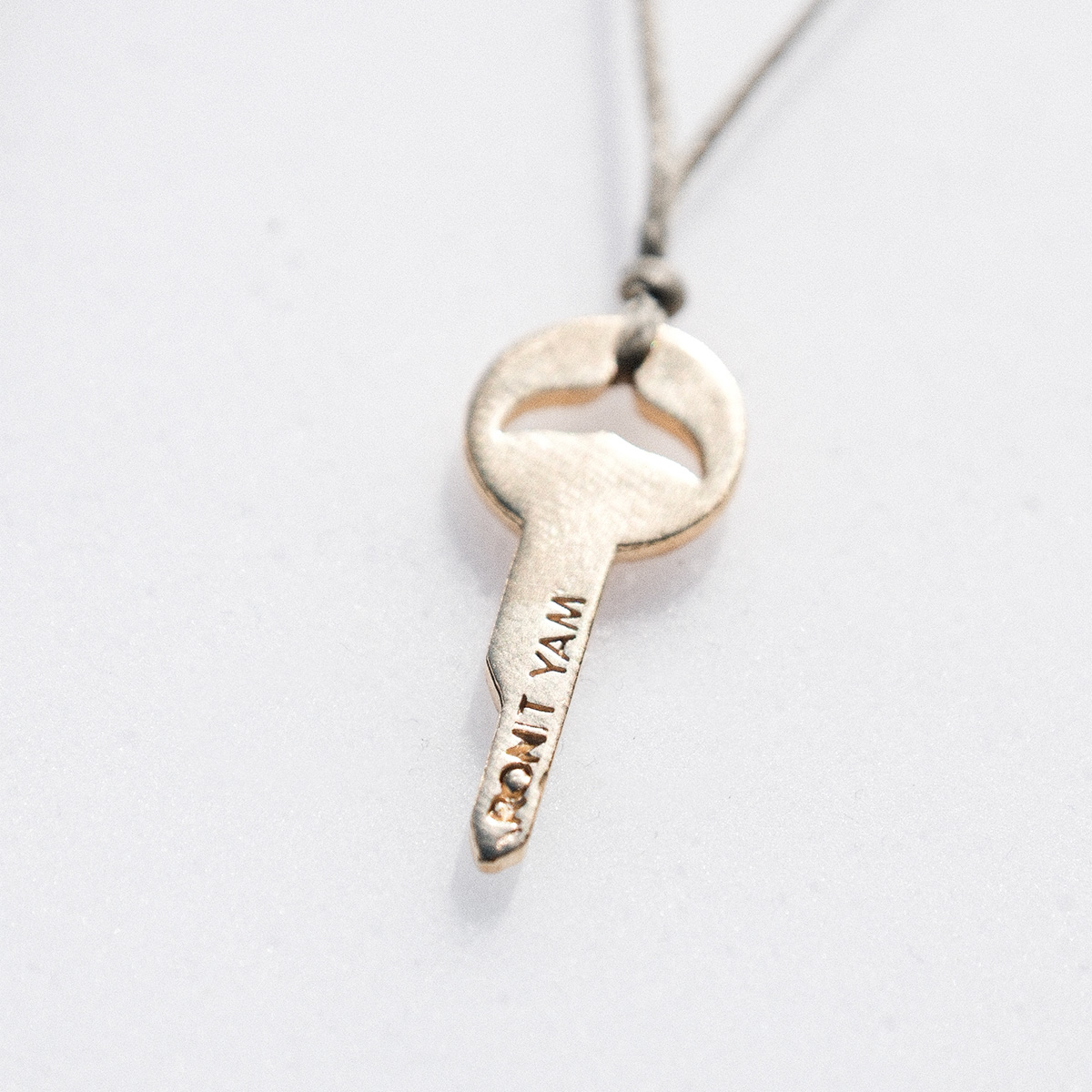 Whale key strand necklace
